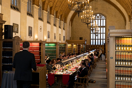 long table with diners in the law library