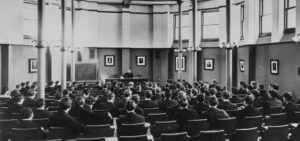 A lecture by Professor Cuthbert W Pound in Boardman Hall, original home of the Law School, circa 1900