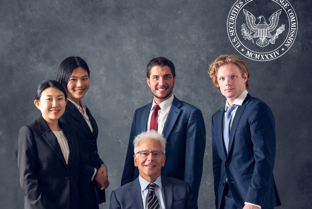 4 students and a faculty member in suits in front of a securities and exchange logo