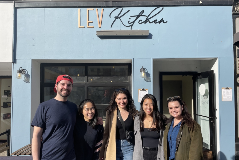 students and clients in front of Lev Kitchen