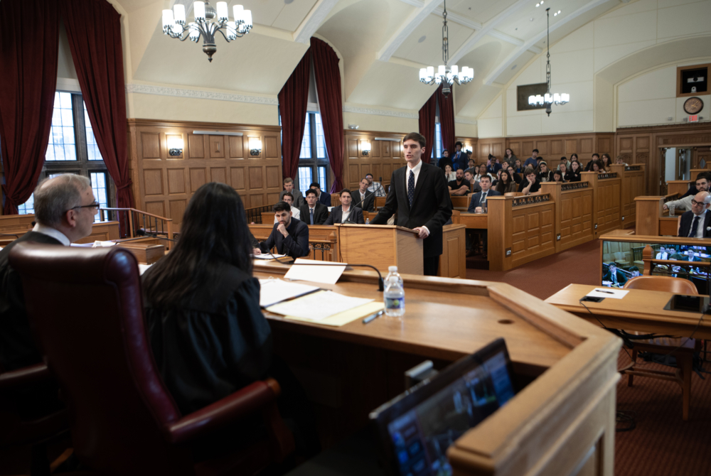 Paul Janes '26 arguing his case in front of the judging panel. 