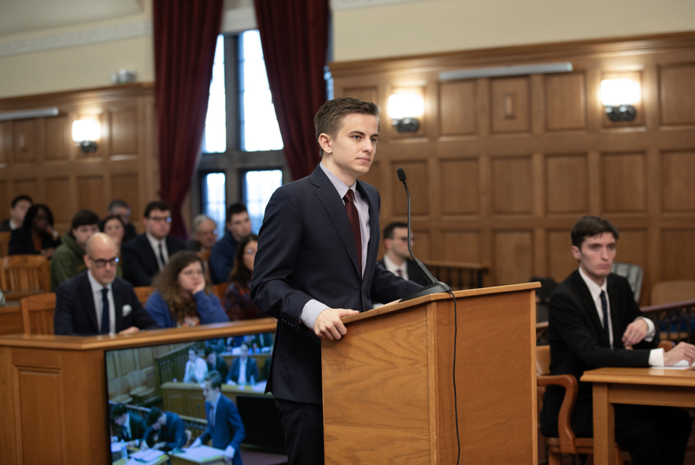 Andrew Hallowell '26 arguing his case in front of the judging panel. 