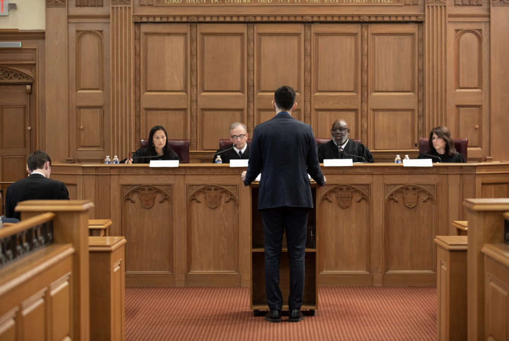 Student arguing his case in front of the judging panel. 