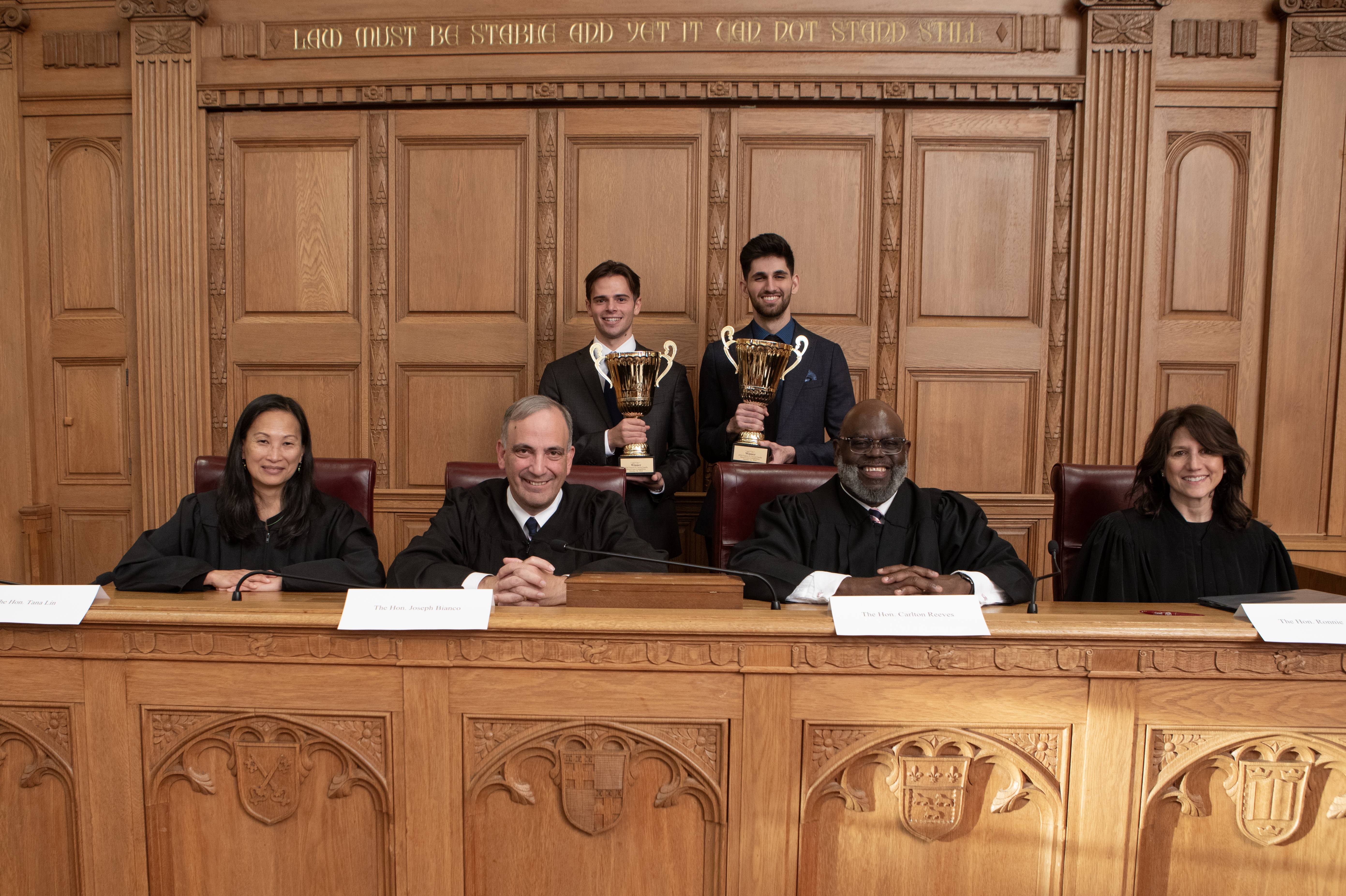 Pictured in the back from left to right: Brian Hartan '26 and Alan Hakki '26. Pictured in the front from left to right: Hon. Tana Lin., Hon. Joseph Bianco, Hon. Carlton Reeves, and Hon. Ronnie Abrams.