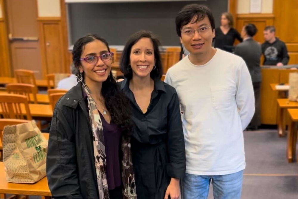 Sara Bronin posing for a photo at her book celebration with two of her students