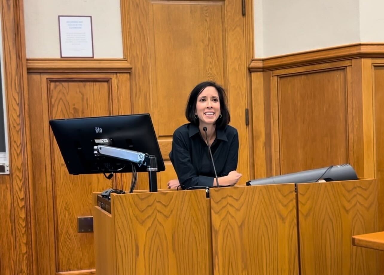 Sara Bronin at her book celebration, addressing the audience from a mic stand